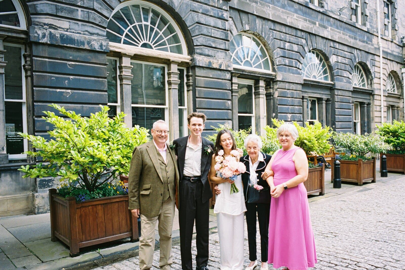 Becca and Rory with family outside Edinburgh Registry Office